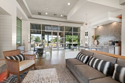 a living room with a couch and a rug